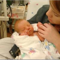<p>Katie Morris in the NICU with her daughter Christie  in 2003.</p>