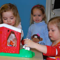 <p>Catherine Cardone, Alice Miller, and Libby Hennemuth enjoy their time at the Toddler Time program at the YWCA Darien/Norwalk.</p>