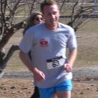 <p>Men&#x27;s 5k winner Dave McCuiston runs during the race.</p>