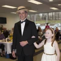 <p>From left: Gene Ceccarelli from Port Chester with 11-year-old Annie Christensen from Rye take the catwalk at Greenwich Hospital&#x27;s fashion show to honor its volunteers. </p>