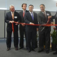 <p>Norwalk officials, state officials and Cervalis representatives cut the ribbon on the new data center in Norwalk.</p>