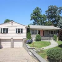 <p>This house at 11 Woodford Road in Scarsdale is open for viewing this Saturday.</p>