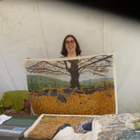 <p>Martha V. North shows off her rugs at Sheep-to-Shawl in Sleepy Hollow.</p>