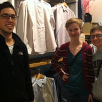 <p>Eric Aniag of Ridgefield, Johanna Tiarks of Stamford and Alex Gatien of Stamford shop at UNIQLO, a new clothing store in Stamford that opened on the weekend.</p>
