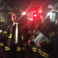 <p>Fairfield Assistant Fire Chiefs Chris Tracey and George Gomola speak about the continuing investigation on Clinton Street with Deputy Police Chief Chris Lyddy late Monday night. </p>