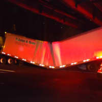 <p>The tractor-trailer buckled under the weight of its load after a crash on I-95 northbound in Norwalk. </p>