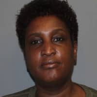 <p>Kymber Moore of Norwalk was charged with using an elderly Norwalk woman&#x27;s ATM card, according to police.</p>