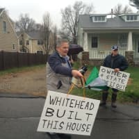 <p>Protesters wave signs in front of the Fairfield home. </p>