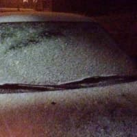 <p>Snow begins to cover a car in Danbury at 11 p.m. Tuesday. </p>
