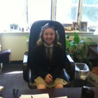 <p>Second-grade student Hadley Faulstich at the principal&#x27;s desk  recently.</p>