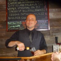 <p>William Bird is back tending bar at the re-opened Keenan House in Ossining.</p>