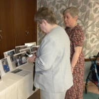 <p>Sisters look at photos from 10 years ago when the Notre Dame Sisters moved to Andrus on Hudson.
</p>