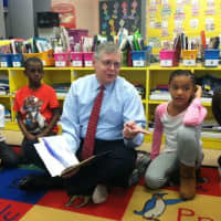 <p>Stamford Mayor David Martin reads to a Grade 2 class at KT Murphy school Wednesday.
</p>