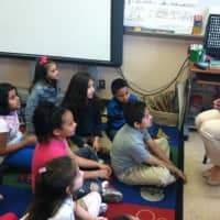 <p>Miss Connecticut Kaitlyn Tarpey reads to a Grade 2 class at KT Murphy school Wednesday.
</p>