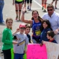 <p>Fairfield&#x27;s Keri O&#x27;Neill meets her family in the 14th mile of the Boston Marathon.</p>
