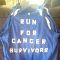 <p>Keri O&#x27;Neill&#x27;s singlet for the Boston Marathon expresses her goal to run for cancer survivors.</p>