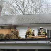 <p>Firefighters are positioned for training at a New Castle home. </p>