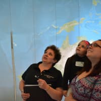 <p>Inside the big globe: Velya Jancz-Urban (left), with Jamie Perna (right) and her niece, Isabelle Perna.</p>