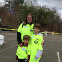 <p>Fairfield resident Molly Melborne  her two sons, 10-year-old Jack and 5-year-old Harry, to volunteer Sunday afternoon at the Food Drive.</p>