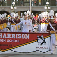 <p>Members of the Harrison High School marching band perform on Main Street USA in Disney World.</p>