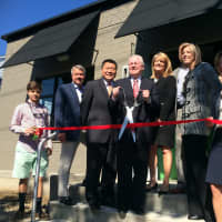 <p>Fairfield Reps. Tony Hwang, Brenda Kupchick and Kim Fawcett with First Selectman Mike Tetreau and Sen Minority Leader John McKinney, joined to help David Ives with his family cut the ribbon for the new office spaces. </p>