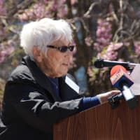 <p>Judy Menken reads a personal note from her son, honoree Alan Menken during the induction ceremony. </p>