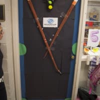 <p>Third-graders show their spirit for Boys &amp; Girls Club by making their door a representation of the pool table.</p>
