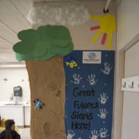 <p>First-graders paint their hands and decorate their door with Boys &amp; Girls Club&#x27;s motto.</p>