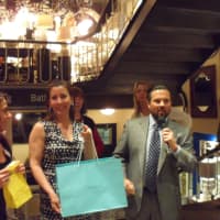 <p>Atlantic Home Loans distributes some of the many raffle prizes.</p>