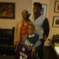 <p>Carol Johnson was on hand with her youngest son to see her son Dashawn, right, sign to attend Vaughn College.</p>