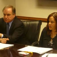 <p>Westchester County Clerk Timothy Idoni, left, and Westchester Residential Opportunities In. director Veronica Raphael talk about the spike in foreclosures in 2013 and 2014. </p>
