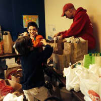 <p>Volunteers gather food for the monthy DoorKnob Dinners project in Hastings-on-Hudson.</p>