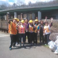<p>Frances McFarland and Any Hudak, among others, work to clean up the Saw Mill River.</p>