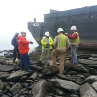 <p>A barge escaped its mooring in Stamford on Wednesday morning and ran aground in Old Greenwich. No one was on board and there was no damage. Officials hope to float it off the rocks either late Thursday or Friday afternoon.</p>