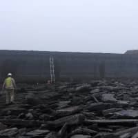 <p>A barge escaped its mooring in Stamford and ran aground on rocks off Old Greenwich. </p>