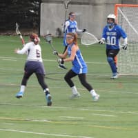 <p>A race to the net between an EHS player and Dobbs Ferry player.</p>
