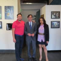 <p>New Rochelle Mayor Noam Bramson, Mahlstedt Gallery Executive Director Oshi Rabin, right, and Ephraim Rabin, left, founder and chief executive officer of Parchem pose in front of some of the featured art. </p>
