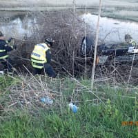 <p>A car had gone off I-95 in Westport and into the embankment resting on it&#x27;s roof with two people trapped inside. </p>