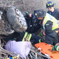 <p>A car had gone off I-95 in Westport and into the embankment resting on it&#x27;s roof with two people trapped inside. Firefighters used the jaws of life to remove the passengers. </p>