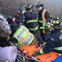 <p>A car had gone off I-95 in Westport and into the embankment resting on it&#x27;s roof with two people trapped inside. Firefighters used the jaws of life to remove the passengers. </p>