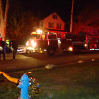 <p>Norwalk firefighters respond to a basement fire at a two-family home on Reservoir Avenue.</p>