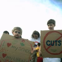 <p>Brothers Owen, 4, and Aiden, 8, Guernsey of Fairfield went to the rally with their mother who said that they spent a lot of time working on their signs.</p>