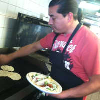 <p>Carlos and Alexandra Terron&#x27;s El Charrito Mexican restaurant business named 25th best taco in country by national food website. The Stamford couple have a small restaurant in Greenwich and a food truck in Stamford. Here Carlos is making a taco.</p>