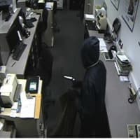 <p>Video surveillance of the person who robbed the People&#x27;s United Bank in Darien.</p>