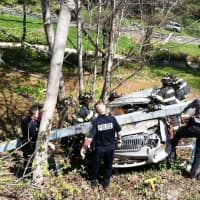 <p>Fairfield police, State Police and Fairfield firefighters work at the I-95 Exit 22 extrication Wednesday morning. </p>