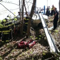 <p>Fairfield firefighters work to extricate a driver on I-95 at southbound Exit 22 after an accident Wednesday morning. </p>