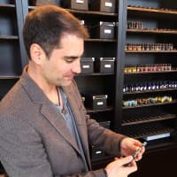 <p>Anthony Holdampf, owner of Sovereign Vapors and a Fairfield resident, shows off the store&#x27;s basic vaporizer, which can be bought in a kit for $25. </p>