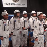 <p>The Young Astronauts stand at attention following the landing of their shuttle.</p>