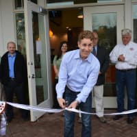 <p>Gregg Roberts cuts the ribbon for Peachwave&#x27;s Armonk location.</p>