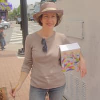 <p>Lizzy Rockwell will paint people creating a quilt for her art piece outside the Norwalk Police Station.</p>